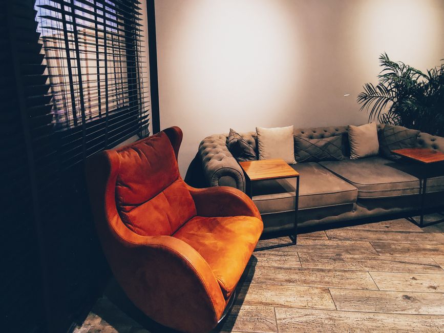 Chic living room interior featuring a modern armchair and plush sofa. Perfect for home decor inspiration.